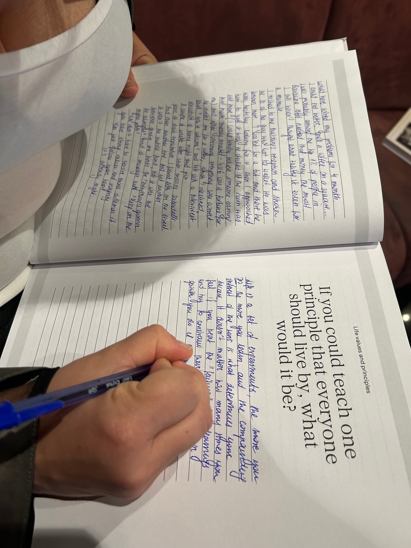 Filled notebook pages showing handwritten answers